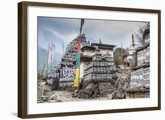 Mani Stones and prayer flags on a trail, Nepal.-Lee Klopfer-Framed Photographic Print