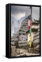 Mani Stones and prayer flags on a trail, Nepal.-Lee Klopfer-Framed Stretched Canvas