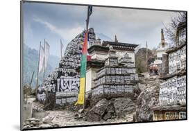 Mani Stones and prayer flags on a trail, Nepal.-Lee Klopfer-Mounted Photographic Print