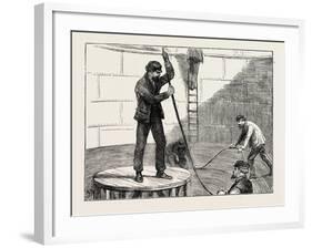 Manufacturing an Electric Telegraph Cable: Coiling Down the Cable in the Tank, 1873-null-Framed Giclee Print