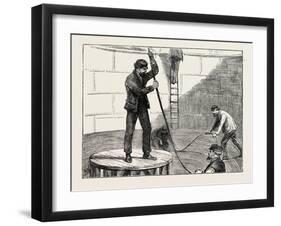 Manufacturing an Electric Telegraph Cable: Coiling Down the Cable in the Tank, 1873-null-Framed Giclee Print