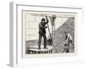 Manufacturing an Electric Telegraph Cable: Coiling Down the Cable in the Tank, 1873-null-Framed Giclee Print