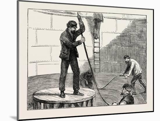 Manufacturing an Electric Telegraph Cable: Coiling Down the Cable in the Tank, 1873-null-Mounted Giclee Print