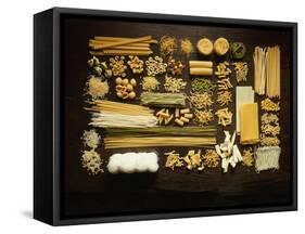 Many Different Types of Pasta on Dark Wooden Background-Walter Cimbal-Framed Stretched Canvas