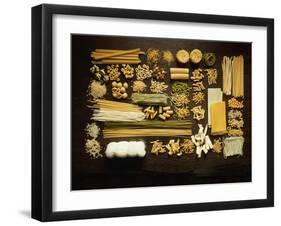 Many Different Types of Pasta on Dark Wooden Background-Walter Cimbal-Framed Premium Photographic Print