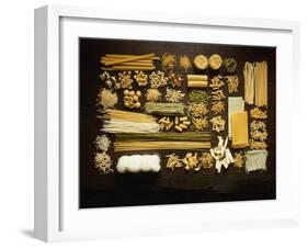 Many Different Types of Pasta on Dark Wooden Background-Walter Cimbal-Framed Photographic Print