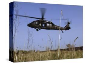 March 31, 2007, a US Army UH-60 Black Hawk Helicopter Prepares to Pick up Soldiers-Stocktrek Images-Stretched Canvas