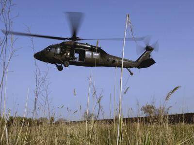 https://imgc.allpostersimages.com/img/posters/march-31-2007-a-us-army-uh-60-black-hawk-helicopter-prepares-to-pick-up-soldiers_u-L-PD39LZ0.jpg?artPerspective=n