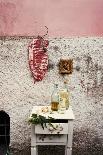 Raw Pork Ribs Hanging on the Wall of a House, Next to a A Gold-Framed Picture-Maria Brinkop-Stretched Canvas