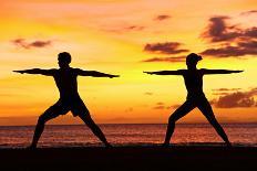 Yoga People Training and Meditating in Warrior Pose Outside by Beach at Sunrise or Sunset-Maridav-Stretched Canvas