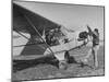 Marie Goerke Sitting in the Plane While the Instructor Kenny Garofalo Stops the Propellor-Bernard Hoffman-Mounted Photographic Print