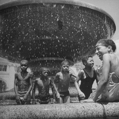 African American Children Playing in a Fountain