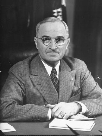 Harry S. Truman Sitting at Desk
