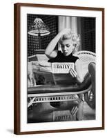 Marilyn Monroe Reading Motion Picture Daily, New York, c.1955-Ed Feingersh-Framed Art Print