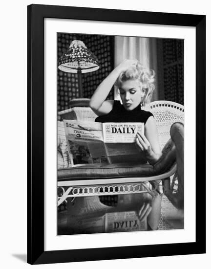 Marilyn Monroe Reading Motion Picture Daily, New York, c.1955-Ed Feingersh-Framed Art Print