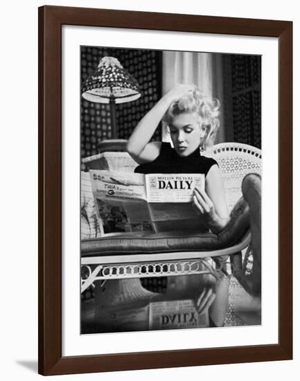 Marilyn Monroe Reading Motion Picture Daily, New York, c.1955-Ed Feingersh-Framed Art Print