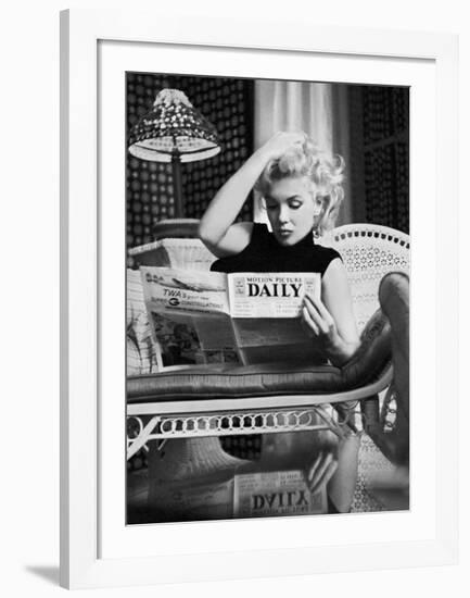 Marilyn Monroe Reading Motion Picture Daily, New York, c.1955-Ed Feingersh-Framed Art Print