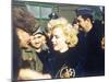 Marilyn Monroe Wearing a Jacket with the 'Mosquito' Patch of the 6147th Tactical Control Group-null-Mounted Photo