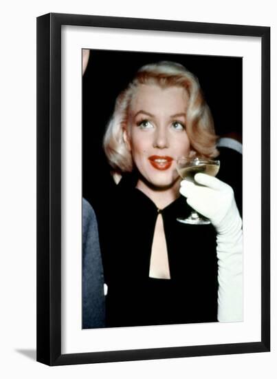 Marilyn Monroe with a Glass of Champagne, 1955-null-Framed Photo