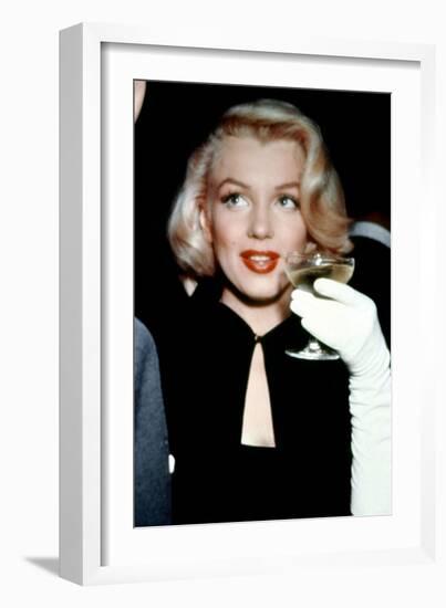 Marilyn Monroe with a Glass of Champagne, 1955-null-Framed Photo