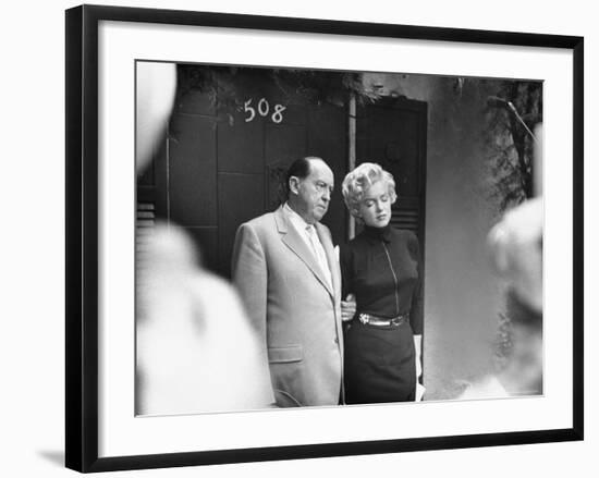 Marilyn Monroe with Her Lawyer Jerry Giesler After Announcement of Her Divorce From Joe DiMaggio-George Silk-Framed Premium Photographic Print