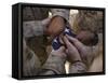 Marines Fold an American Flag after It was Raised in Memory of a Fallen Soldier-Stocktrek Images-Framed Stretched Canvas