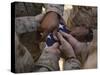 Marines Fold an American Flag after It was Raised in Memory of a Fallen Soldier-Stocktrek Images-Stretched Canvas