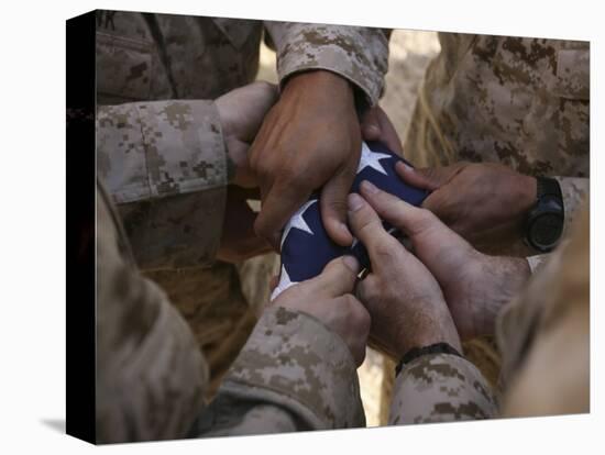 Marines Fold an American Flag after It was Raised in Memory of a Fallen Soldier-Stocktrek Images-Stretched Canvas