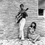 Claudia Mori Looking at Adriano Celentano Playing the Guitar-Marisa Rastellini-Photographic Print