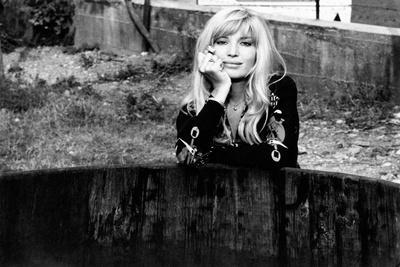 Monica Vitti Leaning on An Edge of a Well