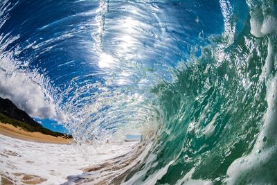 Water shot of a tubing wave off a Hawaiian beach