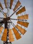 Erongo Region, Okahandja, the Fins of a Windmill Highlighted by the Setting Sun, Namibia-Mark Hannaford-Photographic Print