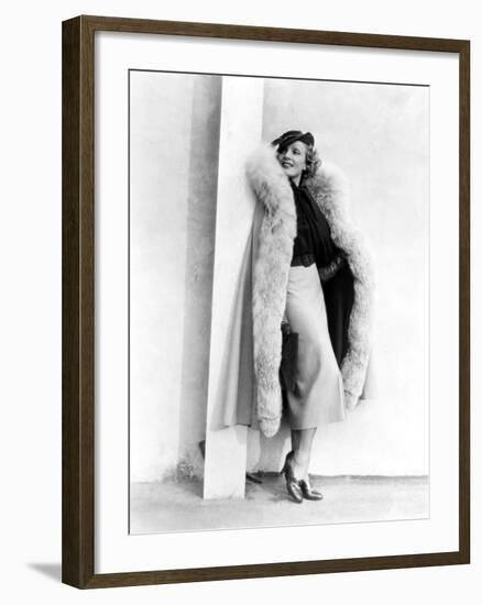 Marlene Dietrich, in a Brown and Beige Suit and Lynx-Trimmed Beige Wool Cape by Travis Banton, 1935-null-Framed Photo