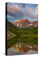 Maroon Bells reflect into calm Maroon Lake near Aspen, Colorado, USA-Chuck Haney-Stretched Canvas