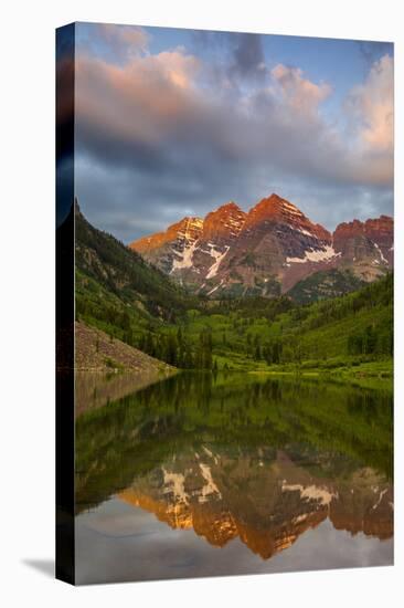 Maroon Bells reflect into calm Maroon Lake near Aspen, Colorado, USA-Chuck Haney-Stretched Canvas