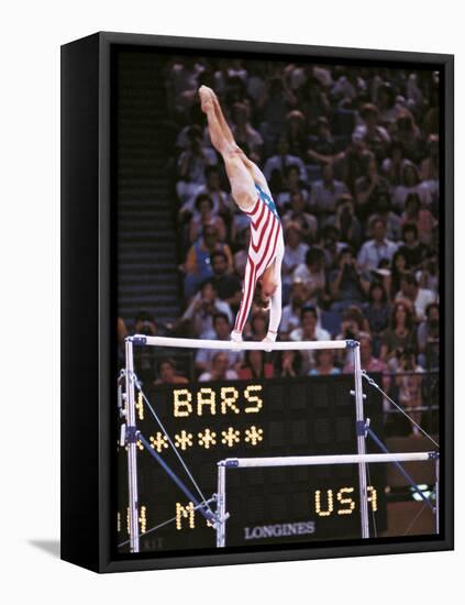 Mary Lou Retton on the Uneven Bars at the Los Angeles Olympic Games-null-Framed Stretched Canvas