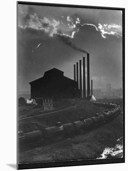 Massive Otis Steel Mill Surrounded by Tanker Cars on Railroad Track on a Cloudy Day-Margaret Bourke-White-Mounted Photographic Print