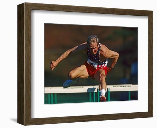 Mature Athlete Competes in Hurdles Race, Atlanta, Georgia, USA-Paul Sutton-Framed Photographic Print