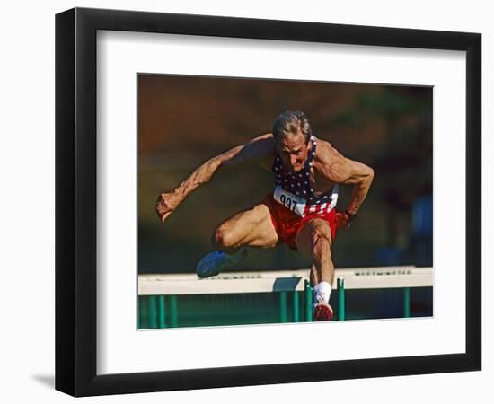 Mature Athlete Competes in Hurdles Race, Atlanta, Georgia, USA-Paul Sutton-Framed Photographic Print