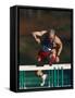 Mature Athlete Competing in Hurdles Race, Atlanta, Georgia, USA-Paul Sutton-Framed Stretched Canvas