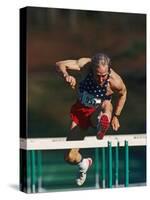 Mature Athlete Competing in Hurdles Race, Atlanta, Georgia, USA-Paul Sutton-Stretched Canvas