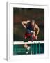 Mature Athlete Competing in Hurdles Race, Atlanta, Georgia, USA-Paul Sutton-Framed Photographic Print