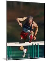 Mature Athlete Competing in Hurdles Race, Atlanta, Georgia, USA-Paul Sutton-Mounted Photographic Print