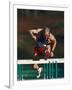 Mature Athlete Competing in Hurdles Race, Atlanta, Georgia, USA-Paul Sutton-Framed Photographic Print