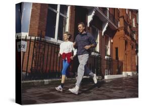 Mature Couple Out on a Fitness Run-Chris Cole-Stretched Canvas