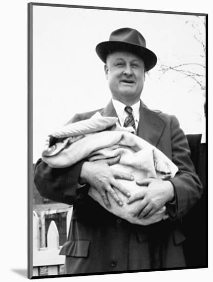 Mature Man Holds a Baby, Ca. 1950-null-Mounted Photographic Print