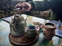 A Hand on a Teapot and Yerba Mate at Refugio Piltriquitron in the Andes of Patagonia, Argentina-Maureen Eversgerd-Photographic Print