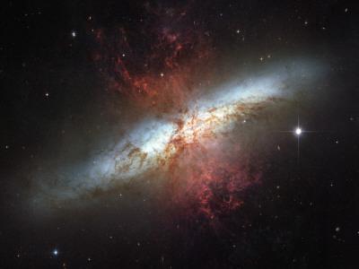 https://imgc.allpostersimages.com/img/posters/may-2006-image-of-the-magnificent-starburst-galaxy-messier-82-m82_u-L-PD3CHI0.jpg?artPerspective=n