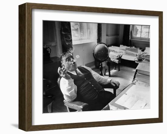 Mayor Fiorello LaGuardia Blowing Smoke Rings Sitting at Desk in His Office-William C^ Shrout-Framed Photographic Print