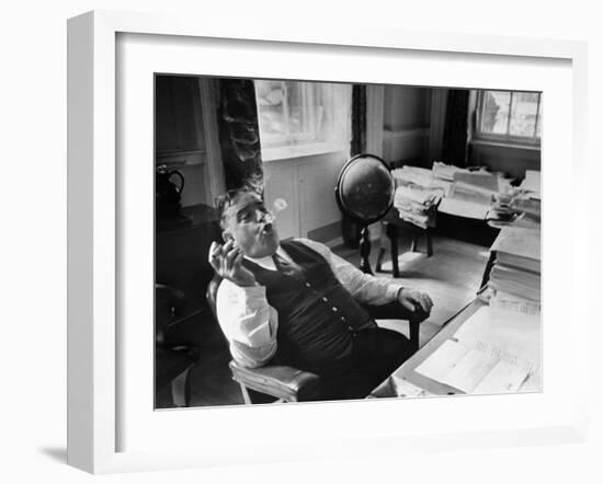 Mayor Fiorello LaGuardia Blowing Smoke Rings Sitting at Desk in His Office-William C^ Shrout-Framed Photographic Print